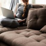 Woman on sofa with laptop